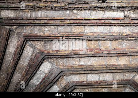 light and dark lines and shades of grey stone, textured ceiling with a red. Stock Photo
