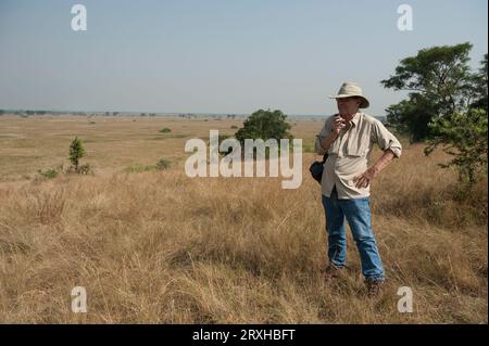 Man admires the scenery in Queen Elizabeth National Park; Uganda Stock Photo