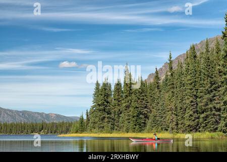 Kayaking on Annie Lake in Canada's Yukon, with beautiful views all around; Whitehorse, Yukon, Canada Stock Photo