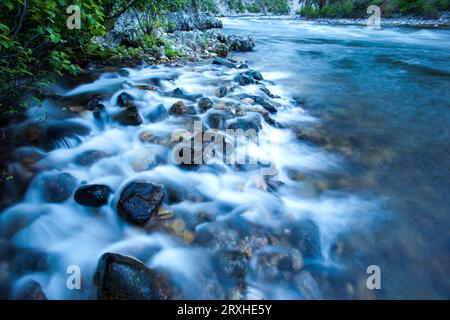 Middle Fork of the Salmon River flowing over a rocky shoreline; Idaho, United States of America Stock Photo