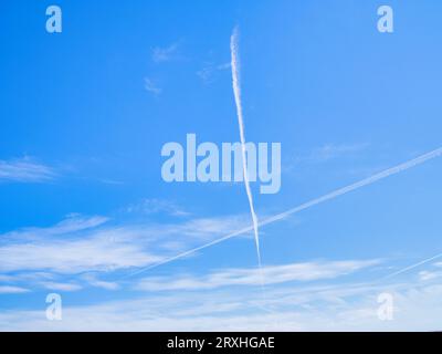Streaky white clouds in blue summer sky. Stock Photo