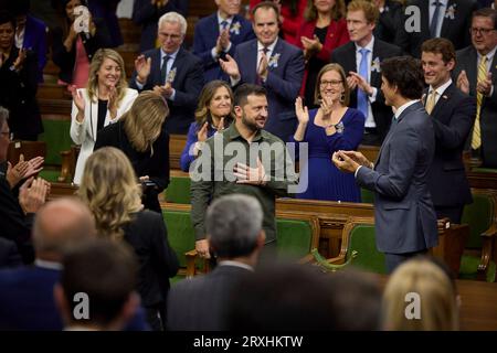 Ottawa, Canada. 22nd Sep, 2023. Ukrainian President Volodymyr Zelenskyy, center, receives a standing ovation from Canadian Prime Minister Justin Trudeau, right, and members of parliament after addressing the House of Commons on Parliament Hill, September 22, 2023 in Ottawa, Canada. Credit: Ukraine Presidency/Ukrainian Presidential Press Office/Alamy Live News Stock Photo