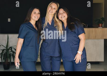 Concept of medicine, women working in a team. Beautiful smiling female health care workers looking at the camera. Stock Photo
