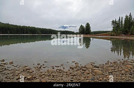 Mirror reflection in Two Jack Lake - Canada Stock Photo
