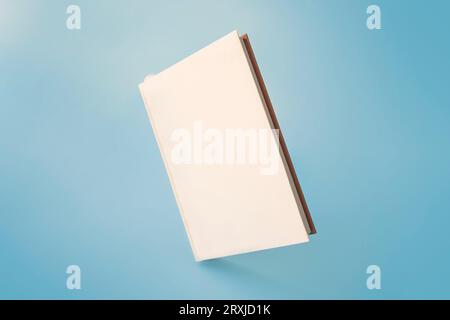Photo blank book cover on blue background Stock Photo