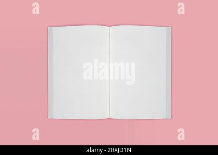 Open book of blank pages top view on a pink background. copy space Stock Photo
