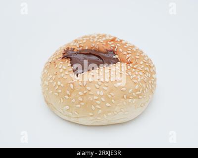 sesame bread with chocolate topping isolated on white Stock Photo