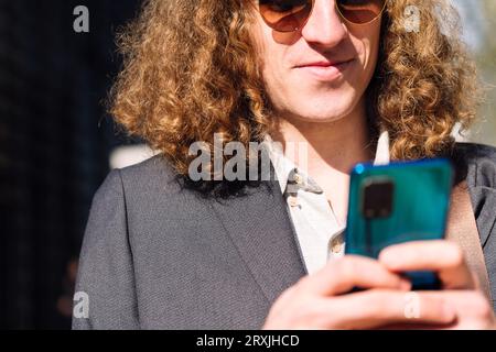 young entrepreneur man using mobile phone Stock Photo