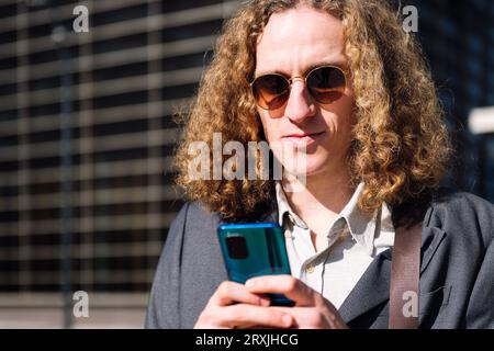 young entrepreneur man using mobile phone Stock Photo