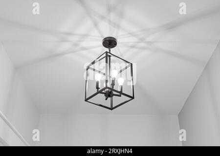 Minimal Bright Modern Light Fixture with Cube Shape Made of Metal Stock Photo