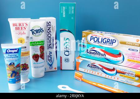 Many, Diversity Of Toothpastes for Kids And Adults, Toothbrush, Tongue Scrapper. Oral Hygiene, Dental Care Set. Horizontal Plane. Phoenix, AZ, USA: 09 Stock Photo