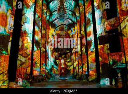 A view of the Nave at Canterbury Cathedral in Kent during a preview of the Luxmuralis: Renaissance, an art installation using moving light displays and original compositions to highlight the cathedral's architecture and immerse visitors in paintings and artwork from the Renaissance period during the Canterbury Festival. Picture date: Monday September 25, 2023. Stock Photo