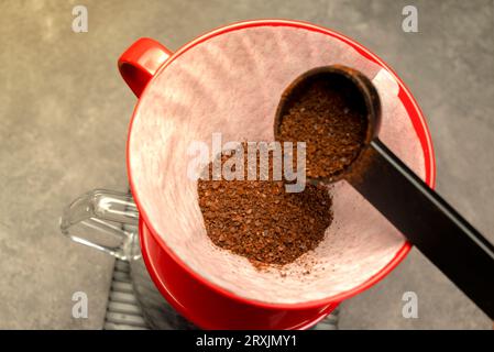 Serves coffee with a V60 dripper coffee maker on the table Stock Photo