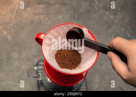 Serves coffee with a V60 dripper coffee maker on the table Stock Photo