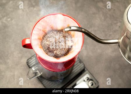 Serves coffee with a V60 dripper coffee maker on the table Stock Photo