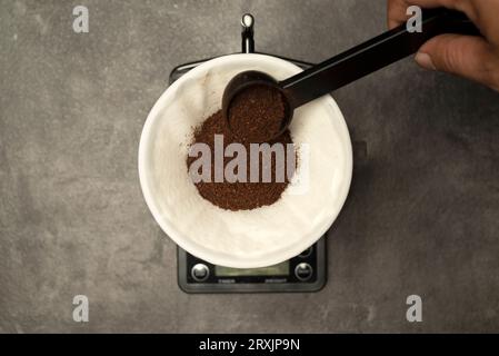 Serves coffee with a V60 dripper coffee maker on the table Stock Photo