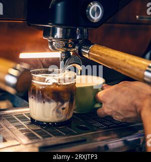 Professional coffee machine making espresso in a cafe Stock Photo