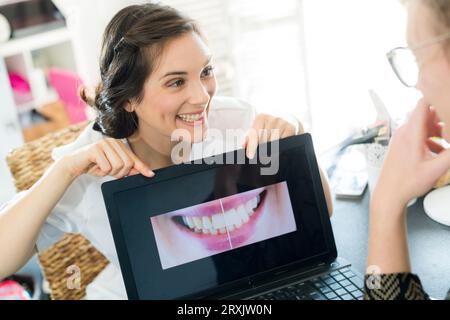 dentist and patient choosing treatment in a consultation Stock Photo