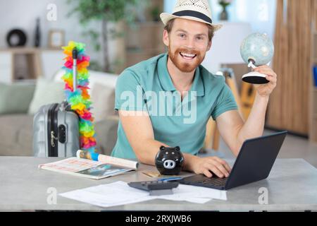 young man consulting with online travel agent Stock Photo