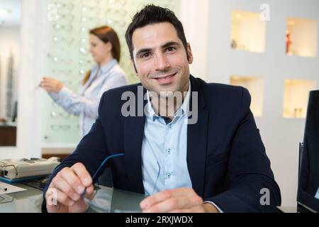 portrait of a suited man in an opticians Stock Photo