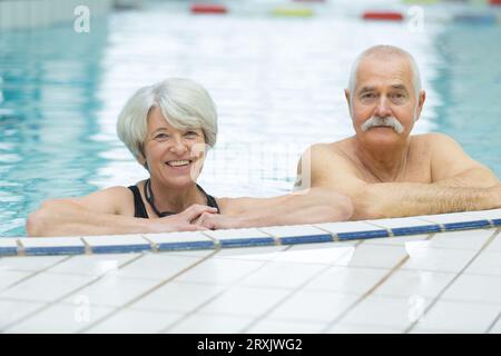 happy senior couple in aqua fitness class swimming pool Stock Photo - Alamy