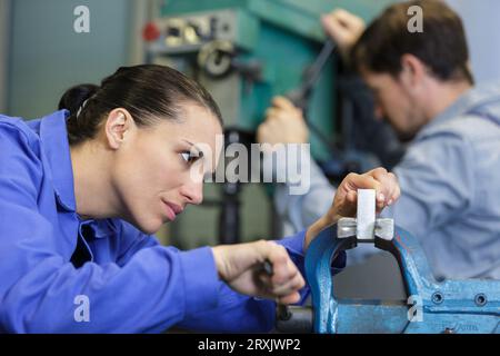 confident young worker in factory Stock Photo