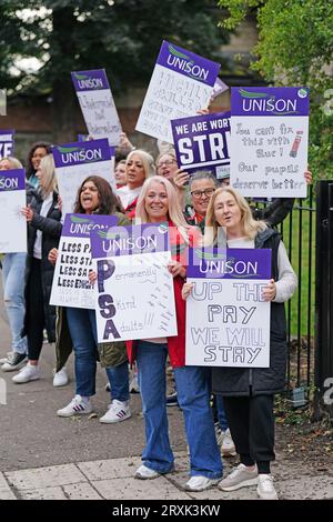 School support workers, who are members of Unison, on the picket line at Trinity Primary School in Edinburgh. Essential school staff including cleaners, janitors and support workers have been locked in a pay dispute, with a new offer estimated to cost £580 million. Picture date: Tuesday September 26, 2023. Stock Photo