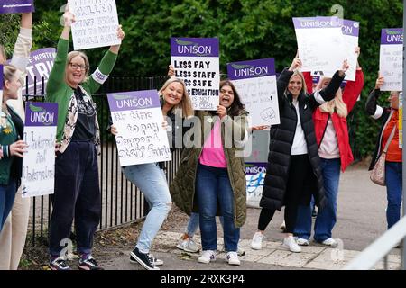 School support workers, who are members of Unison, on the picket line at Trinity Primary School in Edinburgh. Essential school staff including cleaners, janitors and support workers have been locked in a pay dispute, with a new offer estimated to cost £580 million. Picture date: Tuesday September 26, 2023. Stock Photo