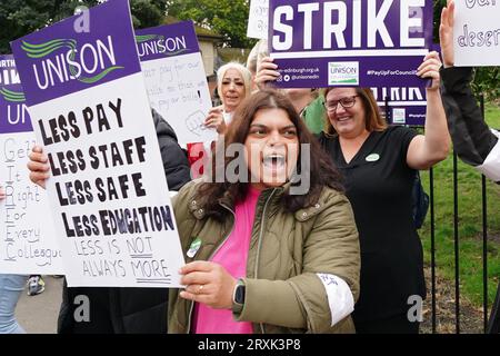 School support workers, who are members of Unison, on the picket line at Trinity Primary School in Edinburgh. Essential school staff including cleaners, janitors and support workers have been locked in a pay dispute, with a new offer estimated to cost £580 million. Picture date: Tuesday September 26, 2023. Stock Photo