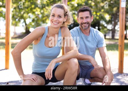 couple stretching after doing exercises Stock Photo