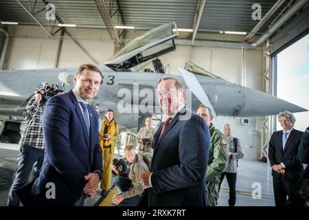 26 September 2023, Estonia, Ämari: Boris Pistorius (r, SPD), Federal Minister of Defense, stands with his Estonian counterpart Hanno Pevkur in front of a Spanish Eurofighter at the Ämari Airbase. After Latvia, Pistorius will also visit neighboring Estonia until Sept. 27, 2023. Photo: Kay Nietfeld/dpa Stock Photo