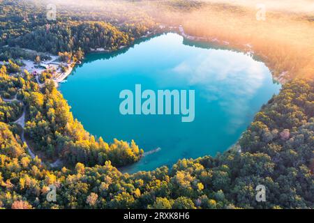High Above the Forest Lake: Embracing the Serenity of Summer's Blue Elegance Stock Photo