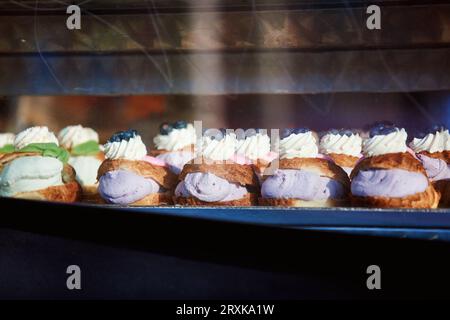 Fastelavnsboller, Danish cream-filled pastries, in shop window Stock Photo