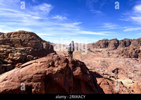 Bedouin roaming Wadi Musa on a mule about to descend a cliff in a Marlborough ad scene, near the High Place of Sacrifice in Petra, Jordan Stock Photo
