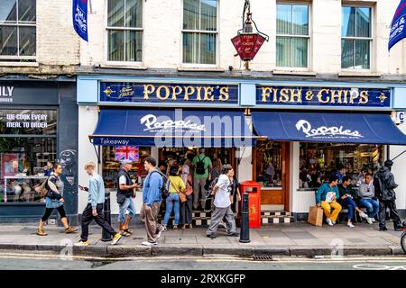 People buying fish and chips at Poppies Fish & Chip shop Spitalfields,London E1 Stock Photo