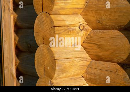 wooden building, with construction details and facade with exposed wooden beams. interlocking beam structure. architecture, design. Stock Photo