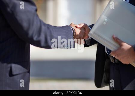 Hands of businessmen shaking hands Stock Photo