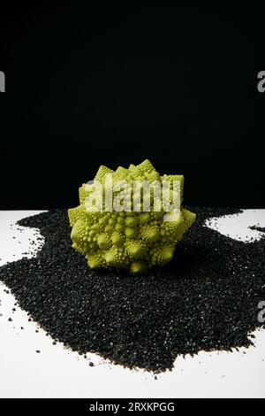 Romanesco cauliflower on black sand Stock Photo