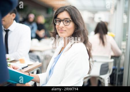 Portrait of businesswoman at restaurant meeting Stock Photo