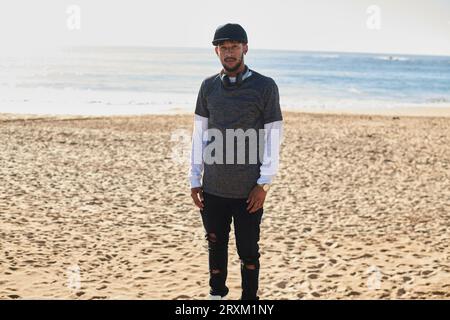 Young man on beach Stock Photo