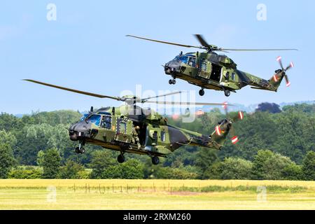 Two German Army NH90 helicopters from International Helicopter Training Centre at Buckeburg about to land during a demonstration. Buckeburg, Germany - Stock Photo