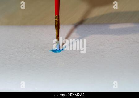 blue paint brush on paper Stock Photo