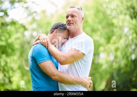 Gay couple hugging Stock Photo