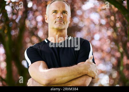 Portrait of mature man with his arms crossed Stock Photo