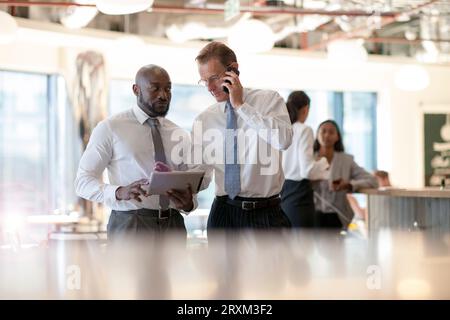 Businessmen using digital tablet and smart phone Stock Photo