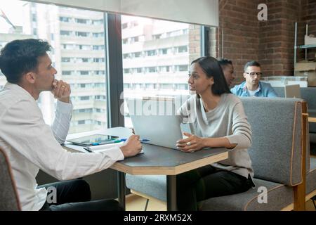 Businesspeople having meeting with laptop Stock Photo