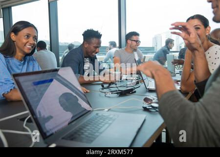 Colleagues using laptops during meeting Stock Photo