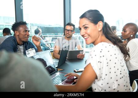 Colleagues using laptops during meeting Stock Photo