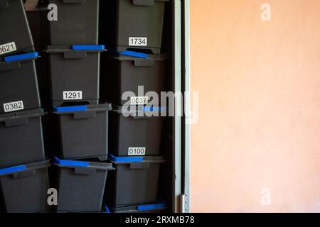 Stacked storage boxes with numbering showing order and organization in companies Stock Photo