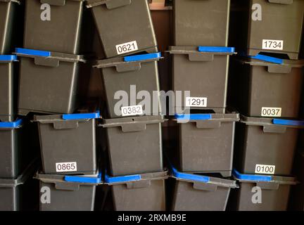 Stacked storage boxes with numbering showing order and organization in companies Stock Photo